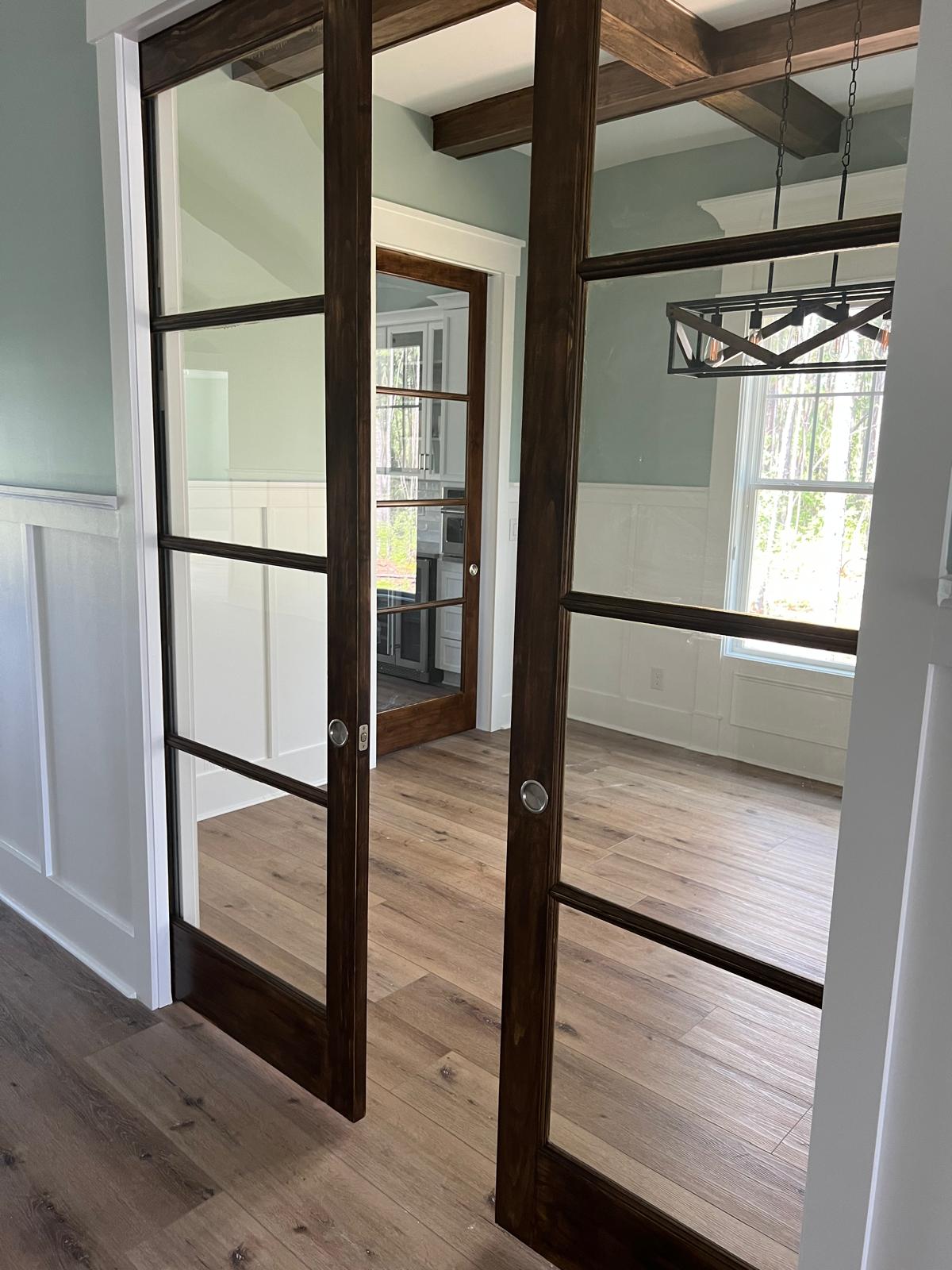 Interior glass-panel doors and trim installed in a renovated home